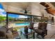 Covered patio area overlooking a sparkling pool at 5213 W Soft Wind Dr, Glendale, AZ 85310