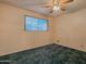 Bright bedroom with ceiling fan and carpet flooring at 5720 E Cicero St, Mesa, AZ 85205