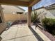 Desert landscaping with covered patio, stone pathway, and cactus at 5829 E Nora St, Mesa, AZ 85215