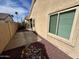 Small backyard with gravel and a patio, next to the house at 5829 E Nora St, Mesa, AZ 85215