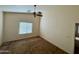 Spacious bedroom with ceiling fan and window blinds at 5829 E Nora St, Mesa, AZ 85215