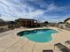 Community pool with a covered patio and lounge chairs at 5829 E Nora St, Mesa, AZ 85215