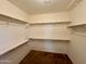 Large walk-in closet with ample shelving and hanging space at 5829 E Nora St, Mesa, AZ 85215