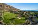 Aerial view of the golf course and resort community at 6000 E Camelback Rd # 7707, Scottsdale, AZ 85251