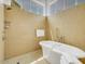 Spa-like bathroom with a deep soaking tub and shower at 6000 E Camelback Rd # 7707, Scottsdale, AZ 85251