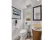 Modern bathroom with pedestal sink and toilet at 6000 E Camelback Rd # 7707, Scottsdale, AZ 85251