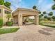 Covered carport with golf cart and lush landscaping at 6000 E Camelback Rd # 7707, Scottsdale, AZ 85251