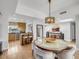 Open concept kitchen and dining area with hardwood floors at 6000 E Camelback Rd # 7707, Scottsdale, AZ 85251