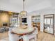 Elegant dining room with modern light fixture and hardwood floors at 6000 E Camelback Rd # 7707, Scottsdale, AZ 85251