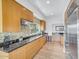 Modern kitchen with stainless steel appliances and granite countertops at 6000 E Camelback Rd # 7707, Scottsdale, AZ 85251