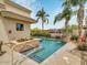 Inviting pool and spa area with a stone water feature at 6000 E Camelback Rd # 7707, Scottsdale, AZ 85251