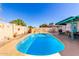 A serene in-ground pool in a backyard setting with ample patio space for outdoor enjoyment at 6058 E El Paso St, Mesa, AZ 85205