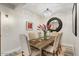 Elegant dining room with a rustic wood table and crystal chandelier at 7117 E Rancho Vista Dr # 3010, Scottsdale, AZ 85251