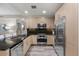 Modern kitchen with stainless steel appliances and granite counters at 7117 E Rancho Vista Dr # 3010, Scottsdale, AZ 85251