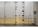 Indoor racquetball court with glass walls and hardwood floor at 7117 E Rancho Vista Dr # 3010, Scottsdale, AZ 85251