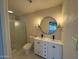 Updated bathroom with double vanity, a large mirror, and a walk-in shower at 7663 E Coolidge St, Scottsdale, AZ 85251