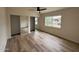 Well-lit bedroom with hardwood floors and mirrored closet doors at 7663 E Coolidge St, Scottsdale, AZ 85251