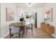 Modern dining area with wood table and stylish chairs at 7663 E Coolidge St, Scottsdale, AZ 85251