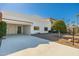 White single-story home with a carport and mature tree at 7663 E Coolidge St, Scottsdale, AZ 85251