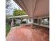 Covered patio with brick flooring, ceiling fan and access to the backyard at 7663 E Coolidge St, Scottsdale, AZ 85251