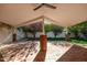 Covered patio with brick pillars and grassy backyard at 7663 E Coolidge St, Scottsdale, AZ 85251