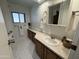 Clean bathroom with white tile floors and updated vanity at 8103 E Southern Ave # 84, Mesa, AZ 85209