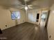 Bright bedroom with laminate flooring and mirrored closet doors at 8103 E Southern Ave # 84, Mesa, AZ 85209