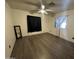 Spacious bedroom with wood-look flooring and large windows at 8103 E Southern Ave # 84, Mesa, AZ 85209