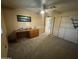 Well-lit bedroom featuring a wooden desk and ample closet space at 8103 E Southern Ave # 84, Mesa, AZ 85209