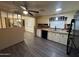 Kitchen with white cabinets, dark countertops, and LVP flooring at 8103 E Southern Ave # 84, Mesa, AZ 85209