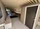 Covered patio with hot tub, storage shed, and tiled floor at 8103 E Southern Ave # 84, Mesa, AZ 85209