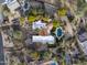 An aerial view of a custom home with a swimming pool, beautiful landscaping, and a private driveway at 8119 E Foothills Dr, Scottsdale, AZ 85255