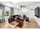 Bright living room featuring hardwood floors, leather furniture, and an abundance of natural light at 8119 E Foothills Dr, Scottsdale, AZ 85255