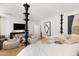 Bright main bedroom with a seating area, hardwood floors, and modern decor at 8119 E Foothills Dr, Scottsdale, AZ 85255