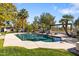 Inviting backyard pool and spa surrounded by lush greenery, mature trees and desert landscaping at 8119 E Foothills Dr, Scottsdale, AZ 85255