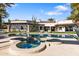 Backyard pool and spa with an outdoor patio, a pergola, desert landscaping and exterior view of the home at 8119 E Foothills Dr, Scottsdale, AZ 85255