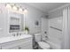 Clean bathroom with a white vanity, bathtub, and grab bar at 814 S 78Th St, Mesa, AZ 85208