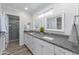 Elegant bathroom with double sinks, granite counters, and a walk-in shower at 814 S 78Th St, Mesa, AZ 85208