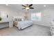 Spacious primary bedroom with a king-size bed and ceiling fan at 814 S 78Th St, Mesa, AZ 85208