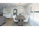 Modern dining room with wood table and white chairs, hardwood floors at 814 S 78Th St, Mesa, AZ 85208