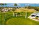 Aerial view of a putting green with palm trees and seating area at 814 S 78Th St, Mesa, AZ 85208