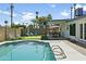 Inviting backyard showcasing a sparkling pool and a putting green for outdoor fun at 8312 E Mackenzie Dr, Scottsdale, AZ 85251