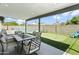 Relaxing covered patio with outdoor seating, overlooking the pool and putting green at 8312 E Mackenzie Dr, Scottsdale, AZ 85251