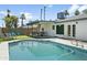 Sparkling pool and well-manicured backyard perfect for relaxing and entertaining guests at 8312 E Mackenzie Dr, Scottsdale, AZ 85251