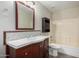 Bathroom with wood vanity, mosaic backsplash and bathtub at 8773 W Pineveta Dr, Arizona City, AZ 85123