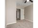 Bright bedroom with carpet and access to another room at 8773 W Pineveta Dr, Arizona City, AZ 85123