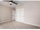 Bedroom with ceiling fan, carpet, and double door closet at 8773 W Pineveta Dr, Arizona City, AZ 85123