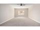 Bright bedroom featuring a large window and ceiling fan at 8773 W Pineveta Dr, Arizona City, AZ 85123