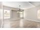 Bright dining area with a modern chandelier and built-in shelving at 8773 W Pineveta Dr, Arizona City, AZ 85123