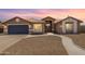 Charming single-story home with a welcoming front entrance and landscaped yard at 8773 W Pineveta Dr, Arizona City, AZ 85123